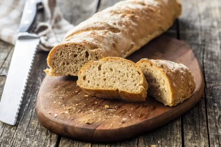 Whole Grain Bread Baguette On Cutting Board